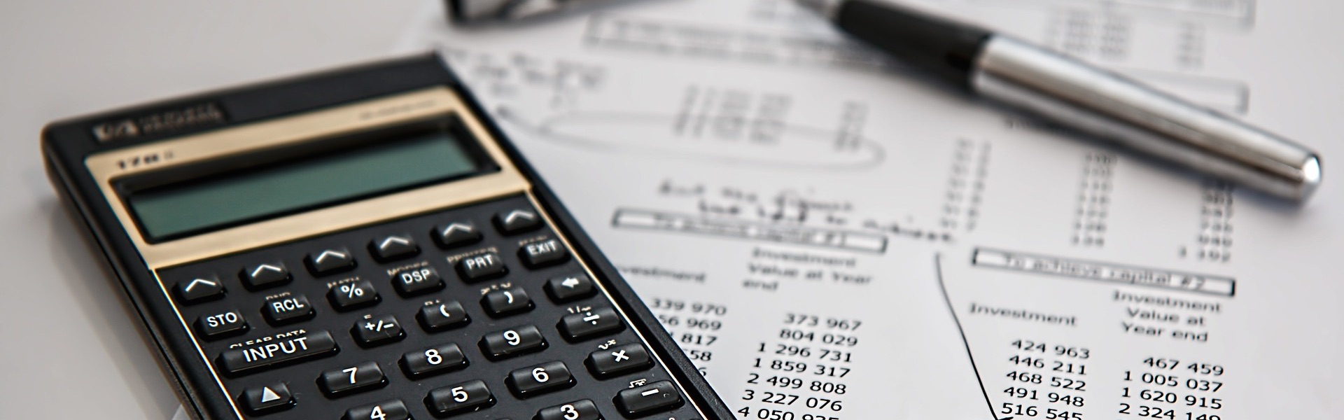 calculator and paper accounts